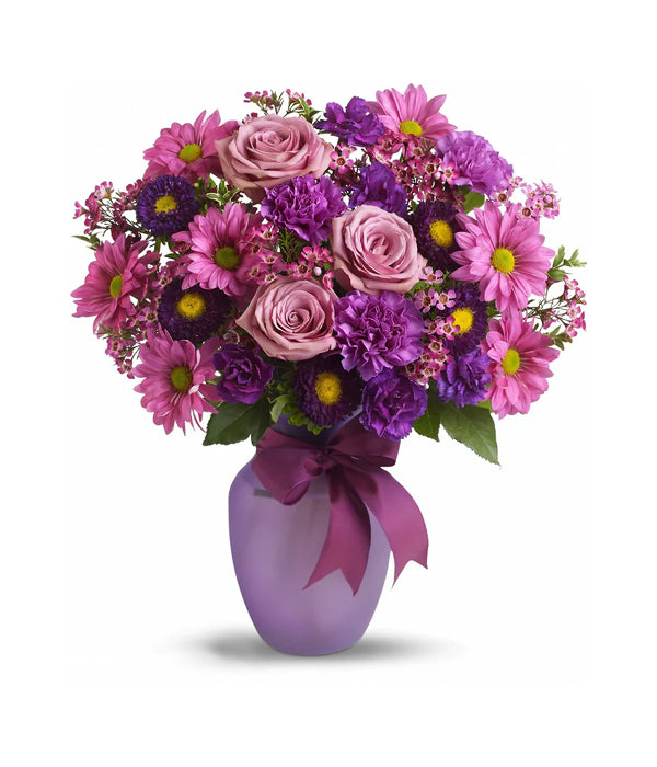 Love & Laughter floral bouquet in purple vase